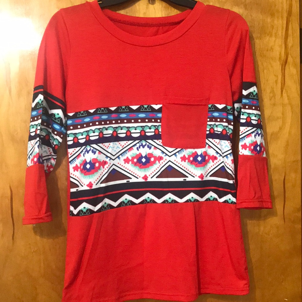 Red quarter length sleeve top with tribal print